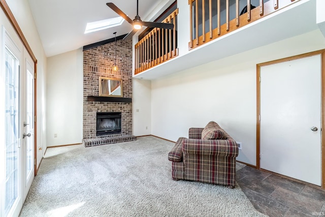 11215 Crested Oak Ct, Fort Wayne, IN 46845 - living room with ceiling fan, high vaulted ceiling, a brick fireplace, and a skylight