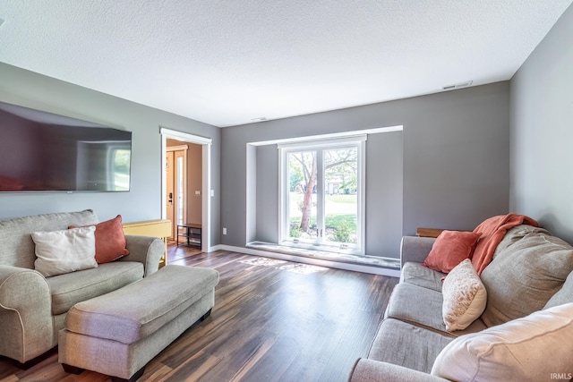 11215 Crested Oak Ct, Fort Wayne, IN 46845 - living area featuring dark wood-type flooring and a textured ceiling