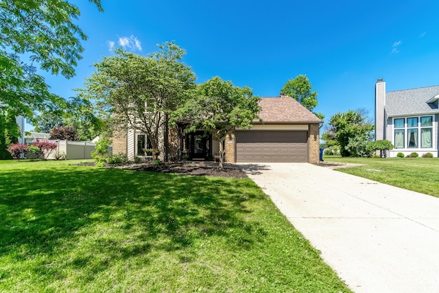11215 Crested Oak Ct, Fort Wayne, IN 46845 - view of front facade with an attached garage, driveway, and brick siding