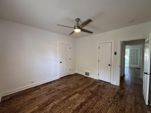 2521 N Red Bank Rd, Evansville, IN 47720 - empty room with dark wood finished floors and a ceiling fan