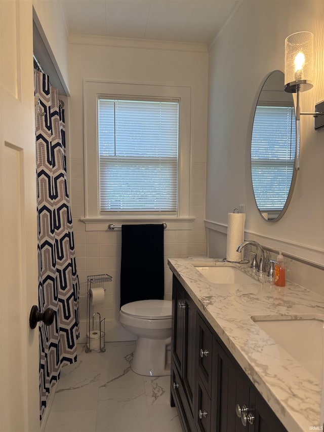 2521 N Red Bank Rd, Evansville, IN 47720 - full bathroom with double vanity, crown molding, and marble look tile flooring