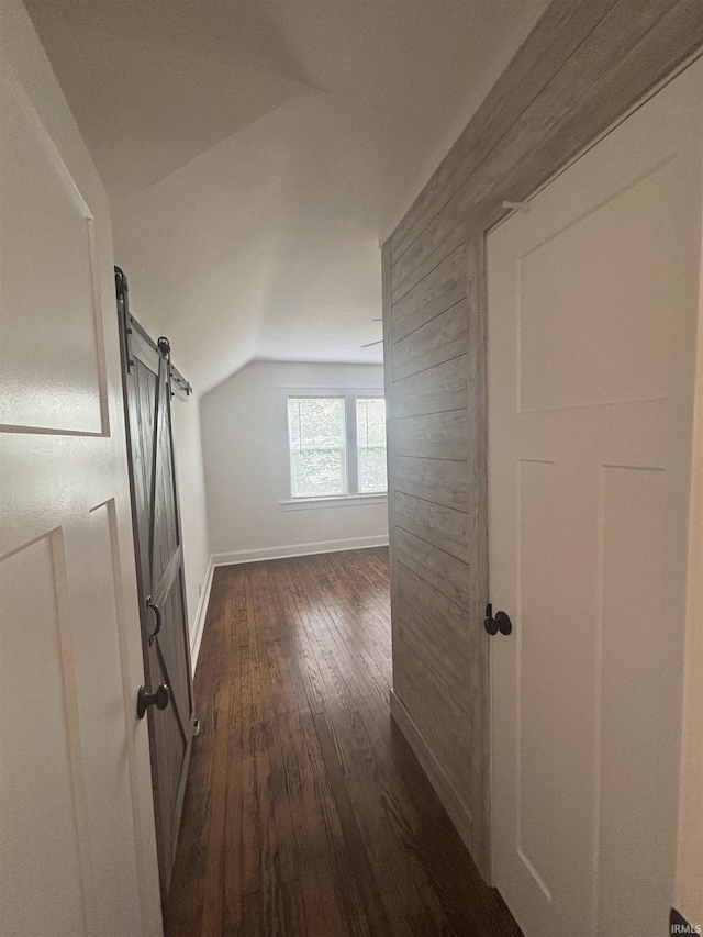 2521 N Red Bank Rd, Evansville, IN 47720 - corridor with dark wood-style flooring, lofted ceiling, and a barn door