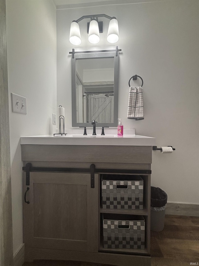 2521 N Red Bank Rd, Evansville, IN 47720 - bathroom with vanity and wood finished floors