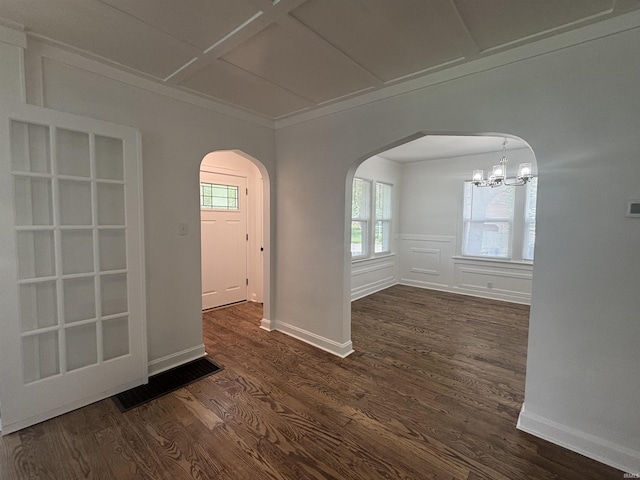 2521 N Red Bank Rd, Evansville, IN 47720 - empty room featuring arched walkways, dark wood finished floors, plenty of natural light, a chandelier, and ornamental molding