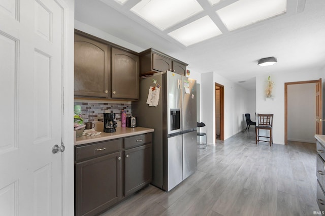 1936 Mark Anthony Xing, Fort Wayne, IN 46818 - kitchen featuring stainless steel fridge, backsplash, light countertops, and light wood-style flooring
