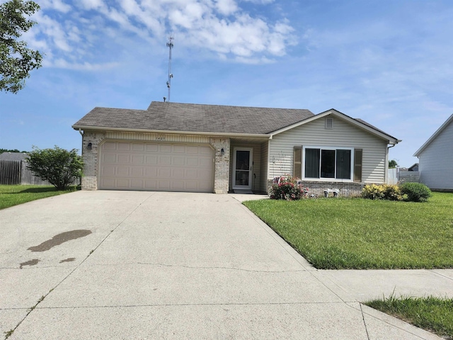 1409 E Bridget Ln, Columbia City, IN 46725 - ranch-style home with brick siding, concrete driveway, a garage, and a front yard