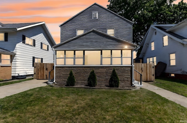 309 E Eckman St, South Bend, IN 46614 - view of front of home featuring stone siding and a gate