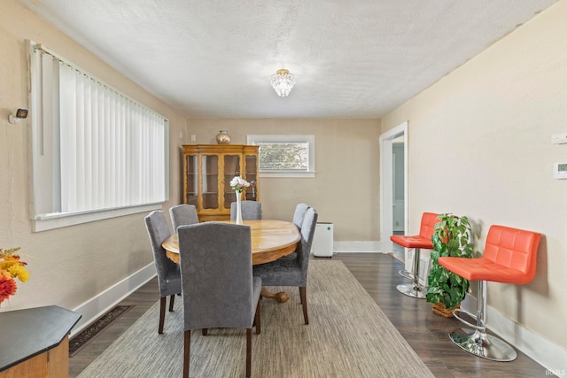 309 E Eckman St, South Bend, IN 46614 - dining space featuring wood finished floors and a textured ceiling