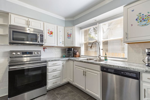 309 E Eckman St, South Bend, IN 46614 - kitchen with appliances with stainless steel finishes, white cabinetry, crown molding, dark tile patterned floors, and tasteful backsplash