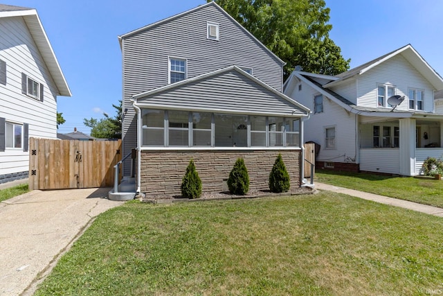 309 E Eckman St, South Bend, IN 46614 - view of front of home featuring a sunroom and driveway