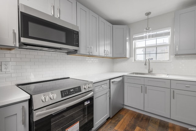 483 N Eddy St Lot # 32, South Bend, IN 46617 - kitchen with appliances with stainless steel finishes, gray cabinets, light countertops, and dark wood-type flooring