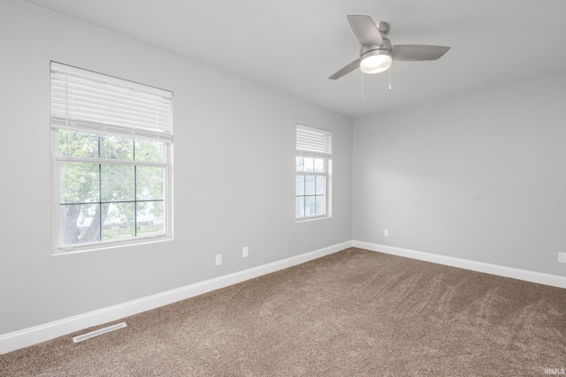 483 N Eddy St Lot # 32, South Bend, IN 46617 - unfurnished room featuring dark colored carpet and ceiling fan