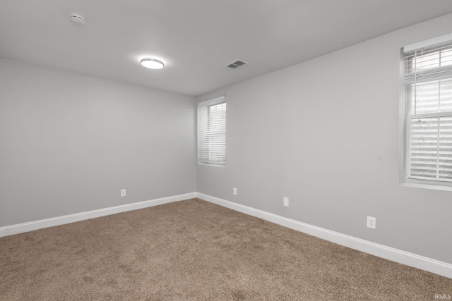 483 N Eddy St Lot # 32, South Bend, IN 46617 - empty room with a smoke detector, carpet flooring, and healthy amount of natural light