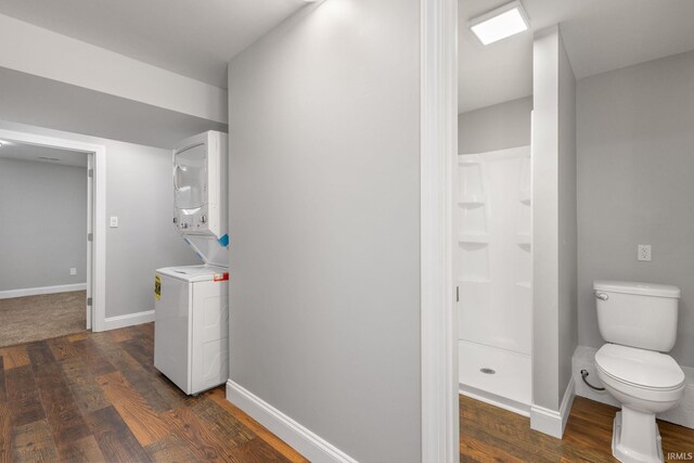 483 N Eddy St Lot # 32, South Bend, IN 46617 - hallway featuring stacked washing machine and dryer and dark wood finished floors