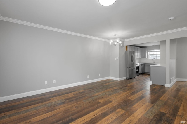 483 N Eddy St Lot # 32, South Bend, IN 46617 - unfurnished living room featuring a chandelier, crown molding, and dark wood-style flooring