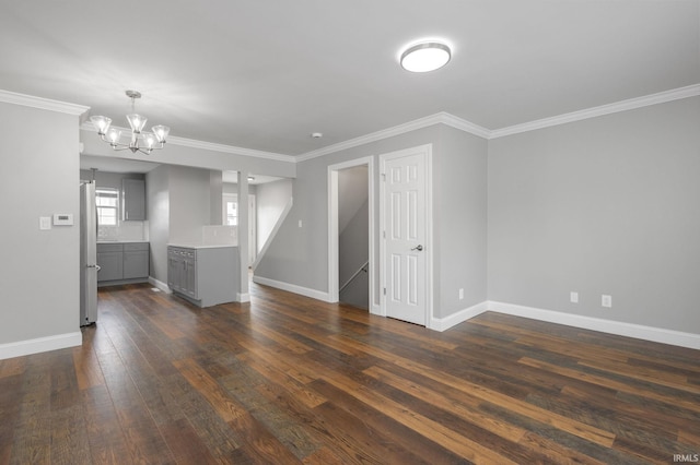 483 N Eddy St Lot # 32, South Bend, IN 46617 - unfurnished living room featuring a chandelier, dark wood finished floors, and ornamental molding