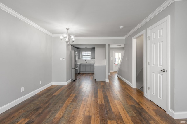 483 N Eddy St Lot # 32, South Bend, IN 46617 - unfurnished room with a chandelier, dark wood-type flooring, ornamental molding, and a smoke detector