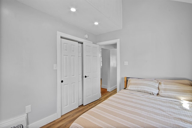 54054 N Ironwood Rd, South Bend, IN 46635 - bedroom featuring wood finished floors, a closet, and recessed lighting