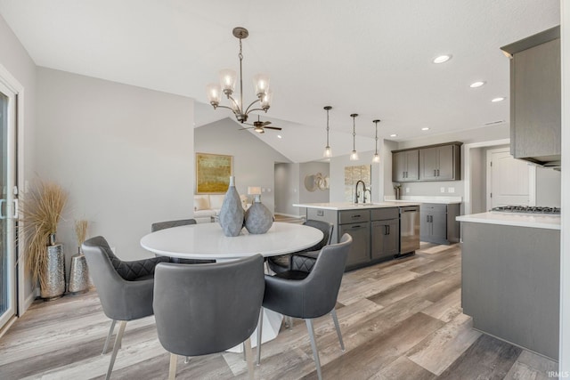 5165 Greyson Heights Dr, Auburn, IN 46706 - dining space featuring a chandelier, light wood finished floors, recessed lighting, and lofted ceiling