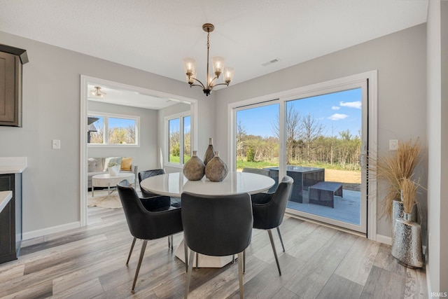 5165 Greyson Heights Dr, Auburn, IN 46706 - dining space featuring light wood-type flooring and a chandelier