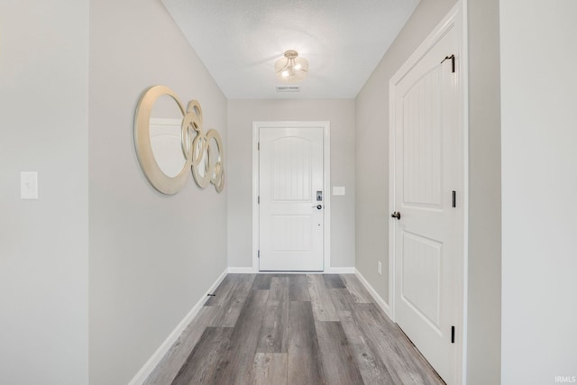 5165 Greyson Heights Dr, Auburn, IN 46706 - doorway with wood finished floors and baseboards