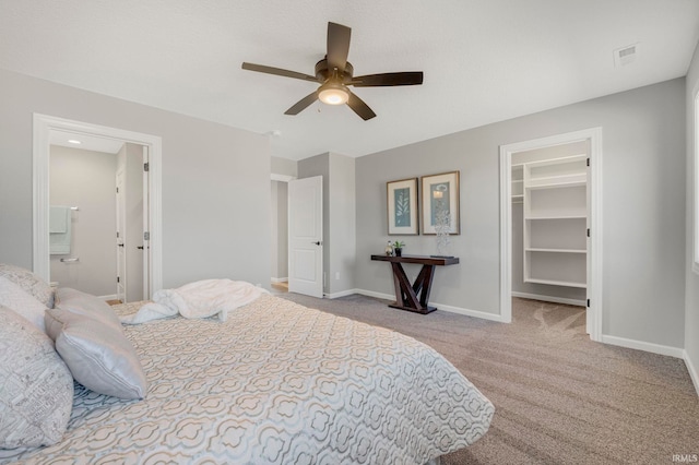 5165 Greyson Heights Dr, Auburn, IN 46706 - bedroom featuring a spacious closet, carpet flooring, a ceiling fan, a closet, and ensuite bath