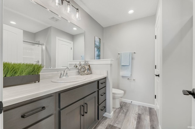 5165 Greyson Heights Dr, Auburn, IN 46706 - full bath featuring vanity, wood finished floors, a shower with door, and recessed lighting