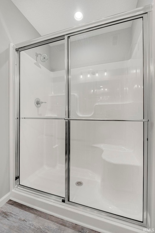 5165 Greyson Heights Dr, Auburn, IN 46706 - bathroom with a stall shower, wood finished floors, and recessed lighting