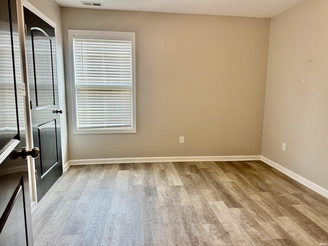391 Hel Mar Dr, Mitchell, IN 47446 - spare room with wood finished floors and plenty of natural light