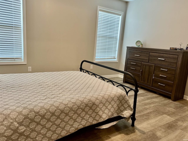 391 Hel Mar Dr, Mitchell, IN 47446 - bedroom featuring light wood-type flooring and baseboards