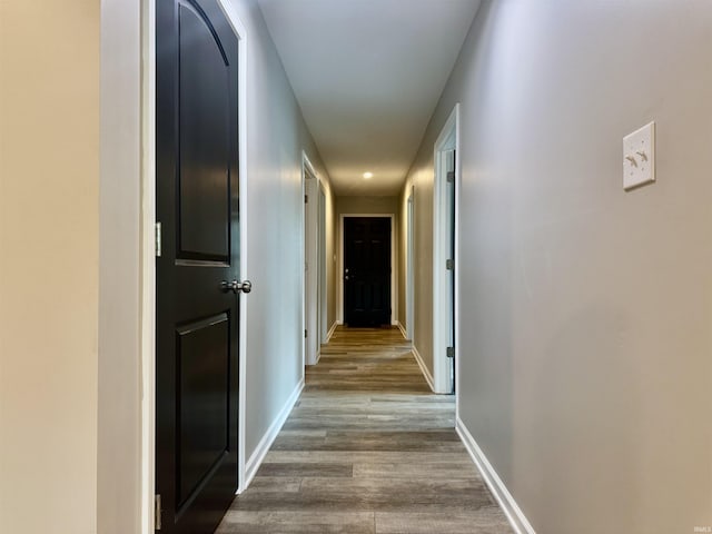 391 Hel Mar Dr, Mitchell, IN 47446 - hallway featuring dark wood-type flooring and baseboards