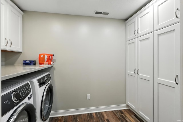 17325 N State Road 1st Rd, Spencerville, IN 46788 - laundry room with cabinet space, washing machine and clothes dryer, and dark wood-type flooring