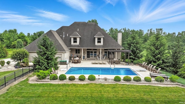 17325 N State Road 1st Rd, Spencerville, IN 46788 - back of property with a patio area and a chimney