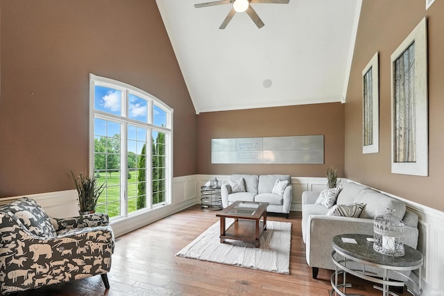 17325 N State Road 1st Rd, Spencerville, IN 46788 - living area with high vaulted ceiling, wainscoting, a ceiling fan, wood-type flooring, and crown molding
