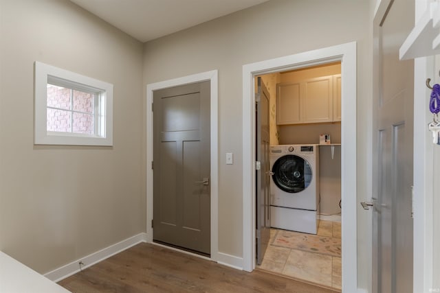 2843 Alex Ct, Newburgh, IN 47630 - washroom with washer / clothes dryer, cabinet space, and wood finished floors