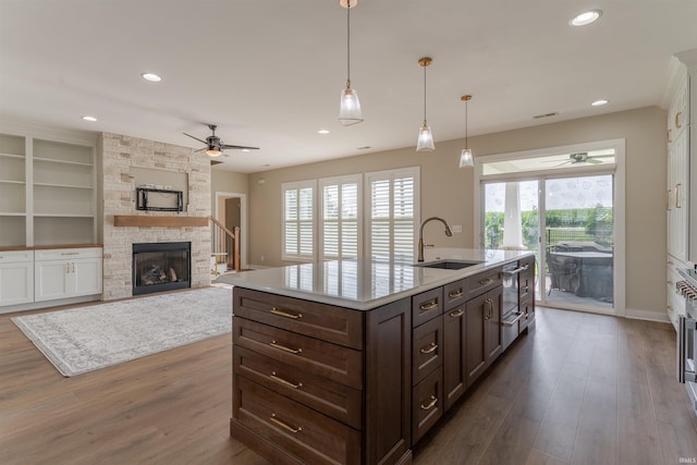 2843 Alex Ct, Newburgh, IN 47630 - kitchen with a ceiling fan, plenty of natural light, dark brown cabinets, dark wood-style flooring, and recessed lighting