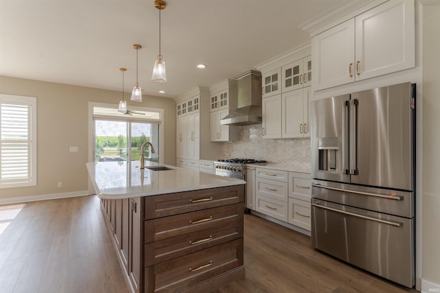 2843 Alex Ct, Newburgh, IN 47630 - kitchen featuring premium appliances, wall chimney exhaust hood, dark wood-style floors, light countertops, and recessed lighting
