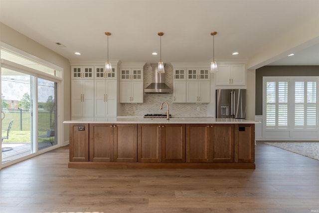 2843 Alex Ct, Newburgh, IN 47630 - kitchen featuring high quality fridge, wall chimney range hood, light countertops, a spacious island, and recessed lighting