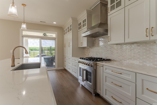 2843 Alex Ct, Newburgh, IN 47630 - kitchen with wall chimney exhaust hood, high end stove, backsplash, light stone counters, and hanging light fixtures