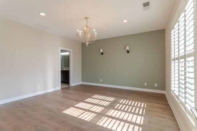 2843 Alex Ct, Newburgh, IN 47630 - empty room with a chandelier, wood finished floors, and recessed lighting