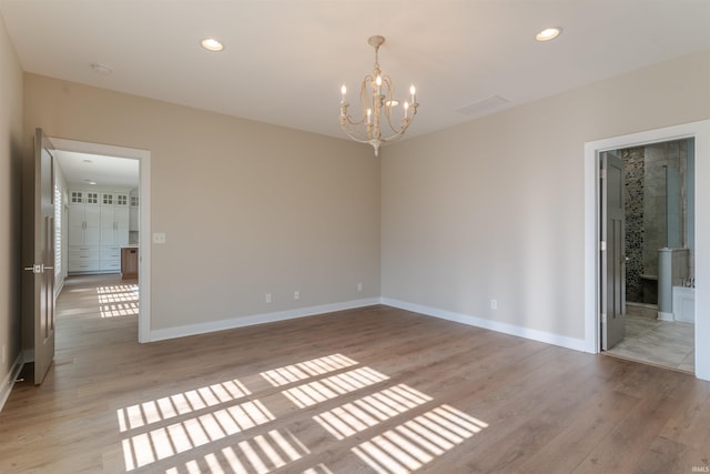 2843 Alex Ct, Newburgh, IN 47630 - unfurnished room with a chandelier, light wood finished floors, a smoke detector, and recessed lighting