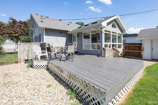 133 Crescent St, Elkhart, IN 46516 - wooden terrace featuring a sunroom and outdoor dining space