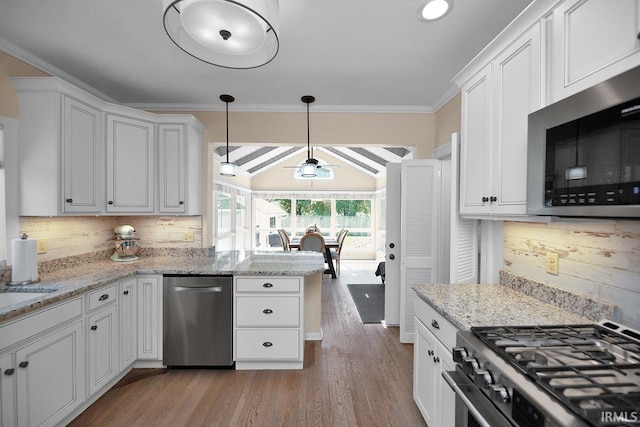 133 Crescent St, Elkhart, IN 46516 - kitchen featuring stainless steel appliances, white cabinets, tasteful backsplash, light wood-type flooring, and ornamental molding
