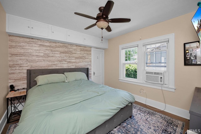 133 Crescent St, Elkhart, IN 46516 - bedroom with cooling unit, ceiling fan, and wood finished floors