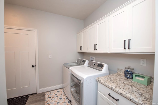5358 Maize Dr, West Lafayette, IN 47906 - laundry area with cabinet space, washing machine and clothes dryer, and light wood-type flooring