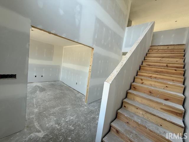 13315 Halen Hill Ct, Fort Wayne, IN 46818 - stairs with unfinished concrete flooring