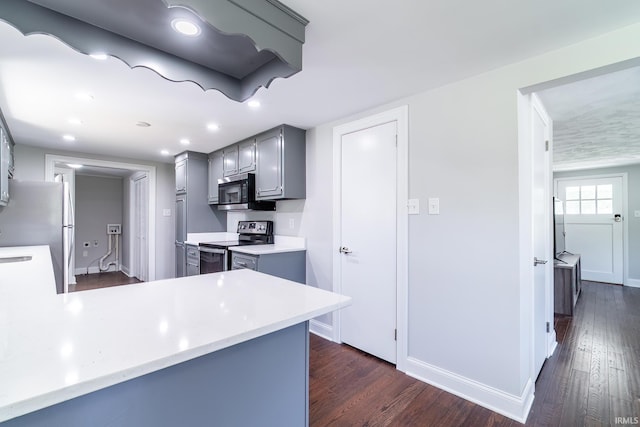 6321 Butt Rd, Fort Wayne, IN 46818 - kitchen featuring appliances with stainless steel finishes, gray cabinets, dark wood finished floors, light countertops, and recessed lighting