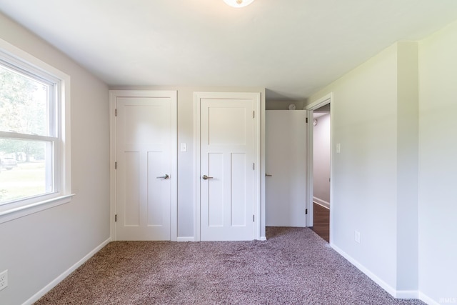 6321 Butt Rd, Fort Wayne, IN 46818 - unfurnished bedroom with multiple windows, carpet floors, and a closet