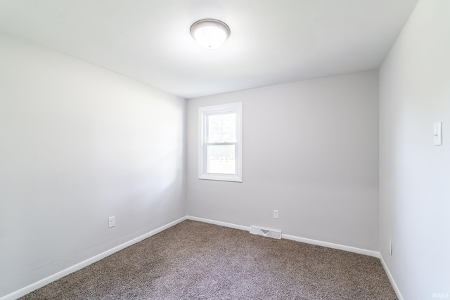 6321 Butt Rd, Fort Wayne, IN 46818 - carpeted empty room with baseboards