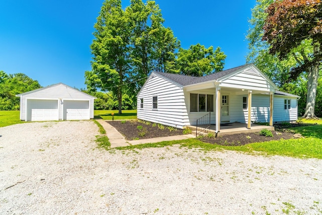 6321 Butt Rd, Fort Wayne, IN 46818 - view of front of home with covered porch, an outdoor structure, and a garage